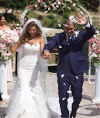 a bride and groom walk down the aisle at their wedding